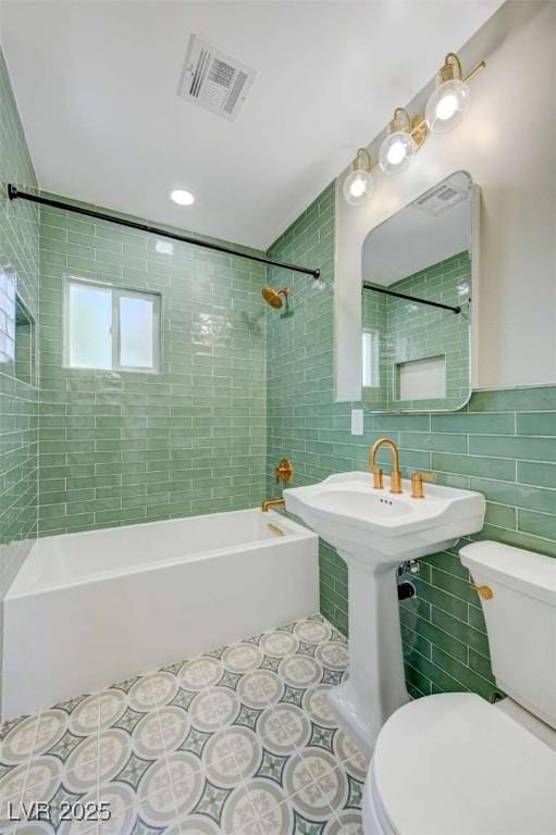 524 Hopi Pl, Boulder City, NV 89005 - bathroom with toilet, tile walls, shower / bath combination, and tile patterned floors