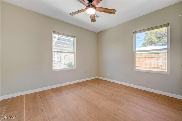 524 Hopi Pl, Boulder City, NV 89005 - spare room with light wood-style flooring, a ceiling fan, and baseboards