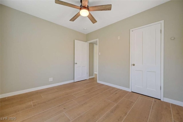 524 Hopi Pl, Boulder City, NV 89005 - unfurnished bedroom with light wood finished floors, baseboards, and ceiling fan