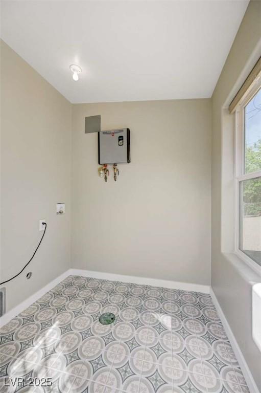 524 Hopi Pl, Boulder City, NV 89005 - spare room featuring baseboards and water heater