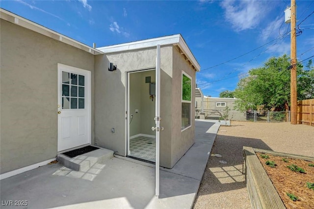 524 Hopi Pl, Boulder City, NV 89005 - view of exterior entry with stucco siding and a patio