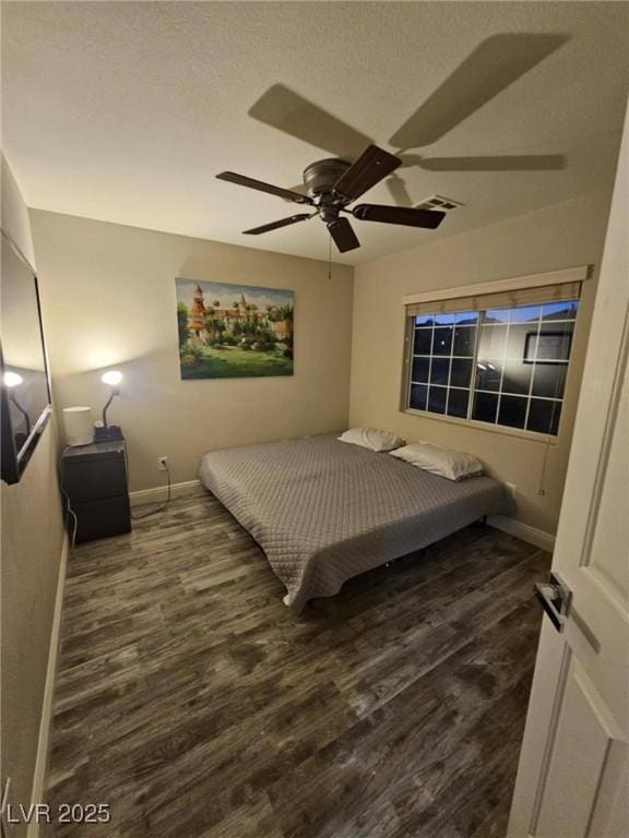2077 Alki Beach Ave, Laughlin, NV 89029 - bedroom featuring baseboards, wood finished floors, and ceiling fan