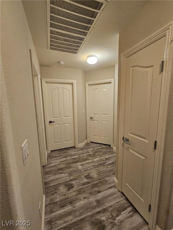 2077 Alki Beach Ave, Laughlin, NV 89029 - corridor featuring dark wood-type flooring and baseboards
