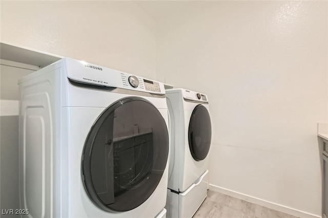 6830 Fallen Rock St, North Las Vegas, NV 89084 - laundry room featuring washer and dryer and baseboards