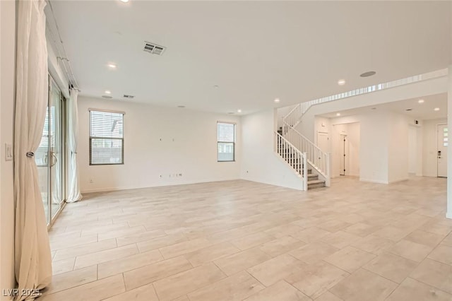 6830 Fallen Rock St, North Las Vegas, NV 89084 - unfurnished living room featuring stairway, recessed lighting, and baseboards