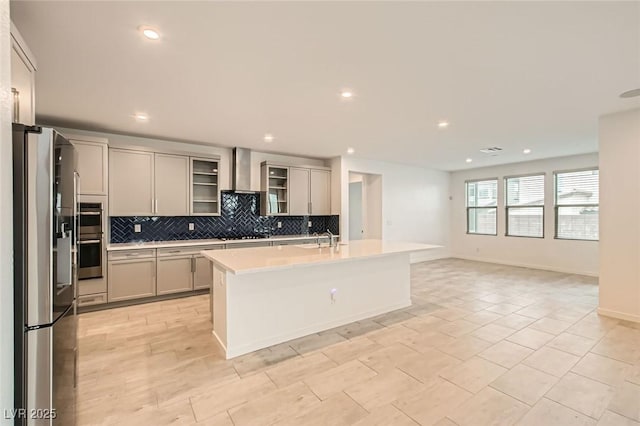 6830 Fallen Rock St, North Las Vegas, NV 89084 - kitchen with stainless steel appliances, backsplash, wall chimney exhaust hood, light countertops, and recessed lighting