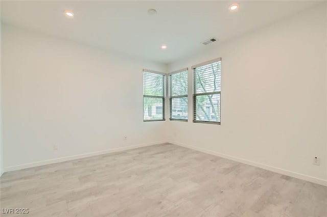 6830 Fallen Rock St, North Las Vegas, NV 89084 - spare room with baseboards, recessed lighting, and light wood-type flooring