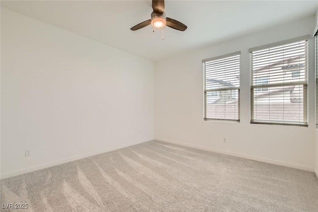6830 Fallen Rock St, North Las Vegas, NV 89084 - empty room featuring light carpet, a ceiling fan, and baseboards