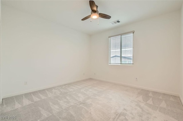 6830 Fallen Rock St, North Las Vegas, NV 89084 - spare room with light colored carpet, baseboards, and a ceiling fan