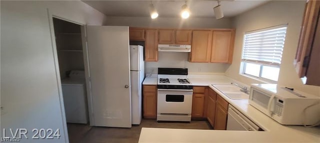 4555 Sahara Ave Unit 252, Las Vegas, NV 89104 - kitchen with white appliances, under cabinet range hood, light countertops, and a sink