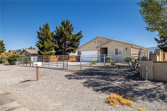 100 Eton St, Pahrump, NV 89048 - view of front of property featuring a gate, a garage, stucco siding, and driveway