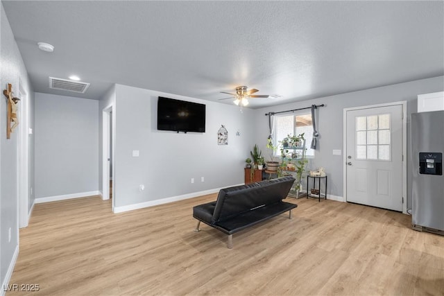 100 Eton St, Pahrump, NV 89048 - living area featuring light wood finished floors and ceiling fan