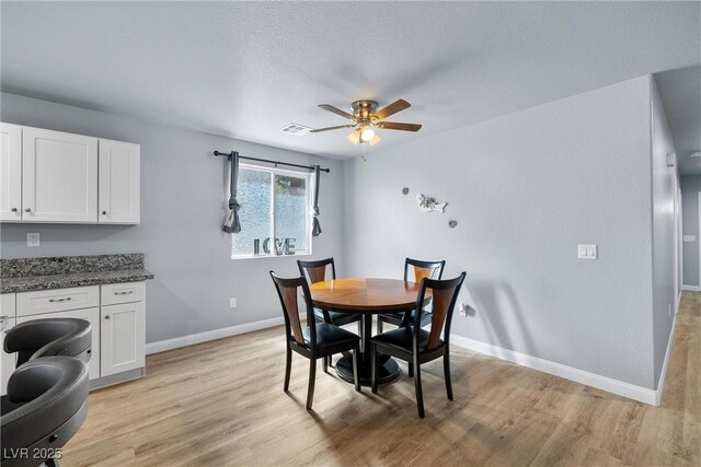 100 Eton St, Pahrump, NV 89048 - dining area featuring a ceiling fan and light wood-type flooring