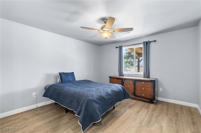 100 Eton St, Pahrump, NV 89048 - bedroom with light wood-style floors and a ceiling fan