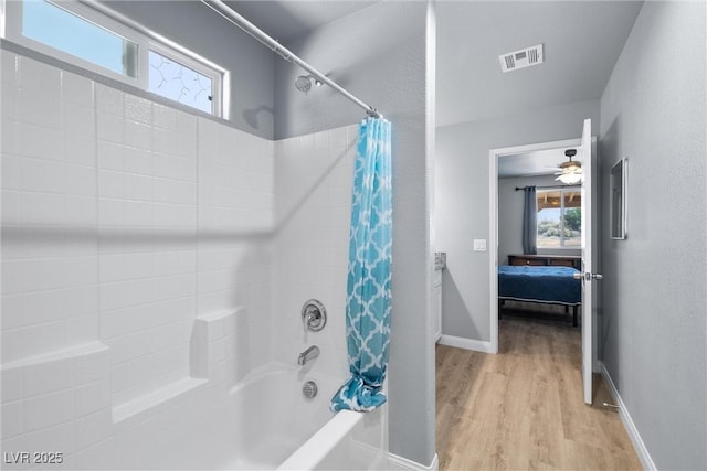 100 Eton St, Pahrump, NV 89048 - bathroom featuring shower / tub combo with curtain, connected bathroom, and wood finished floors