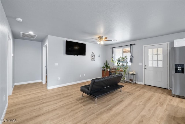 100 Eton St, Pahrump, NV 89048 - living room with light wood finished floors and ceiling fan
