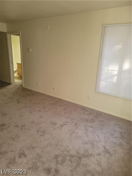 7730 Secret Shore Dr Unit 207, Las Vegas, NV 89128 - unfurnished room with carpet flooring and baseboards