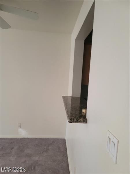 7730 Secret Shore Dr Unit 207, Las Vegas, NV 89128 - hallway featuring carpet and baseboards