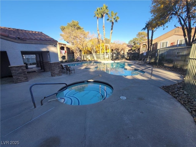 7730 Secret Shore Dr Unit 207, Las Vegas, NV 89128 - community pool featuring a community hot tub and a patio area