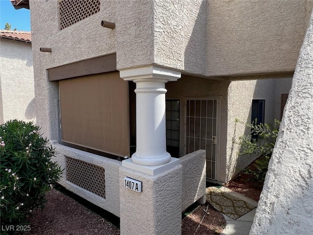 1407 Santa Margarita St Unit A, Las Vegas, NV 89146 - exterior view of ornate columns and stucco siding