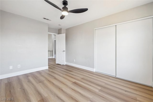 2409 Alpine Meadows Ave, Henderson, NV 89074 - unfurnished bedroom with a closet, light wood-style floors, baseboards, and ceiling fan