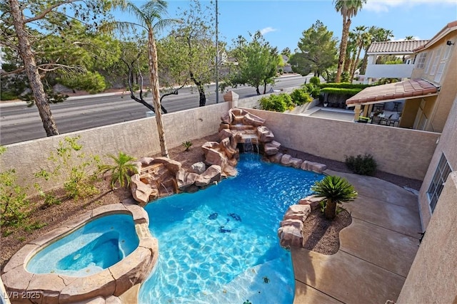 2409 Alpine Meadows Ave, Henderson, NV 89074 - view of swimming pool featuring a pool with connected hot tub and a fenced backyard