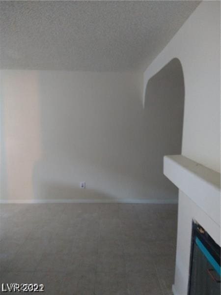 1608 N Torrey Pines Dr Unit 103, Las Vegas, NV 89108 - empty room featuring a textured ceiling