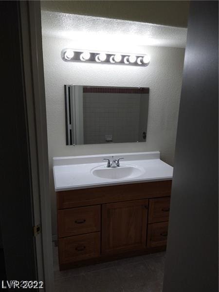 1608 N Torrey Pines Dr Unit 103, Las Vegas, NV 89108 - bathroom with vanity and tile patterned flooring