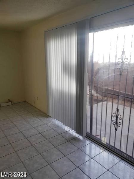 3435 Villa Knolls S Dr, Las Vegas, NV 89120 - spare room with tile patterned flooring