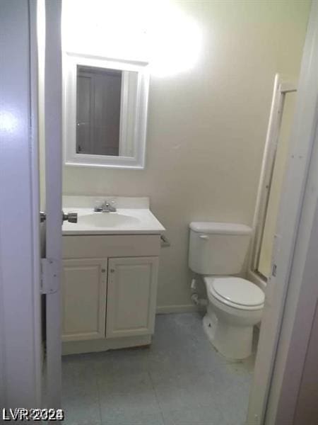 3435 Villa Knolls S Dr, Las Vegas, NV 89120 - bathroom with vanity, toilet, tile patterned flooring, and baseboards