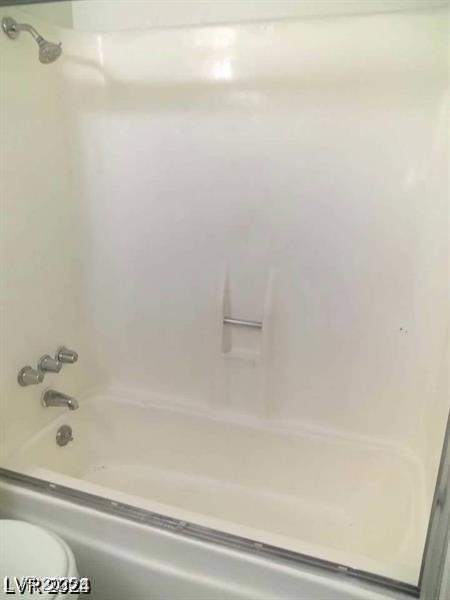 3435 Villa Knolls S Dr, Las Vegas, NV 89120 - bathroom featuring toilet and shower / tub combination