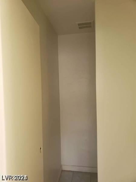 3435 Villa Knolls S Dr, Las Vegas, NV 89120 - corridor featuring light tile patterned floors and baseboards