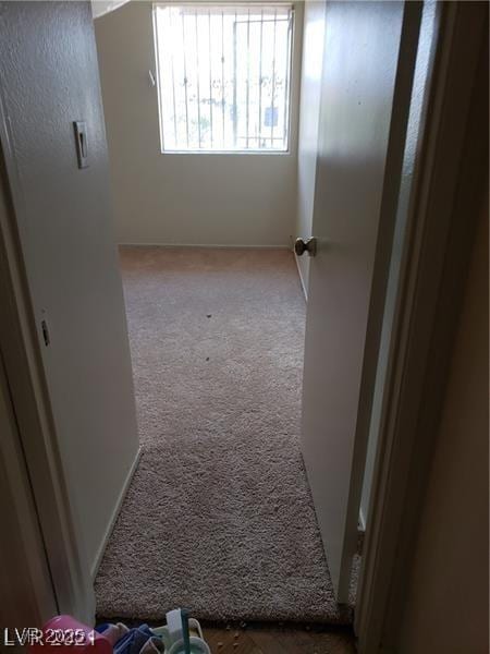 4231 White Sands Ave, Las Vegas, NV 89121 - corridor with carpet and baseboards