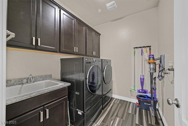 3096 Beaux Art Ave, Henderson, NV 89044 - laundry area with washing machine and dryer, cabinet space, baseboards, and wood finished floors