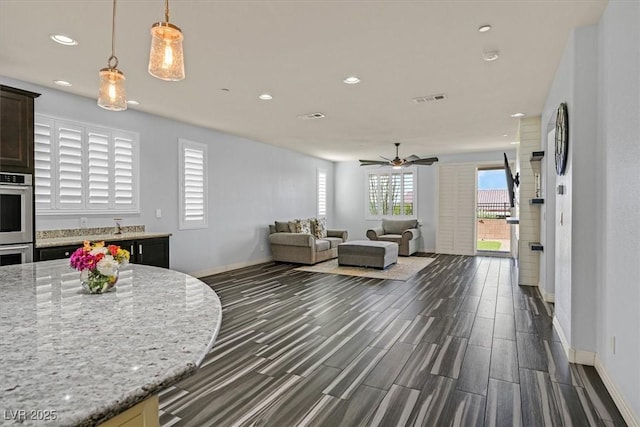 3096 Beaux Art Ave, Henderson, NV 89044 - living area with recessed lighting, dark wood-type flooring, baseboards, and ceiling fan