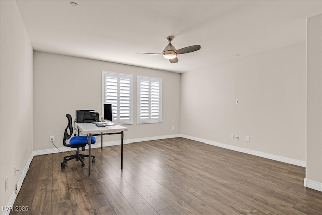 3096 Beaux Art Ave, Henderson, NV 89044 - unfurnished office with a ceiling fan, dark wood-style flooring, and baseboards