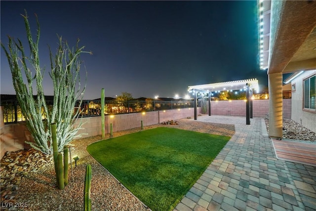 3096 Beaux Art Ave, Henderson, NV 89044 - yard at night with a patio and a pergola