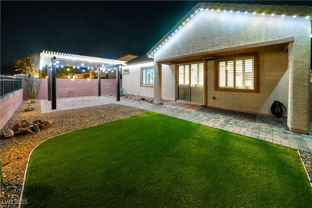 3096 Beaux Art Ave, Henderson, NV 89044 - yard at night with a patio and a pergola