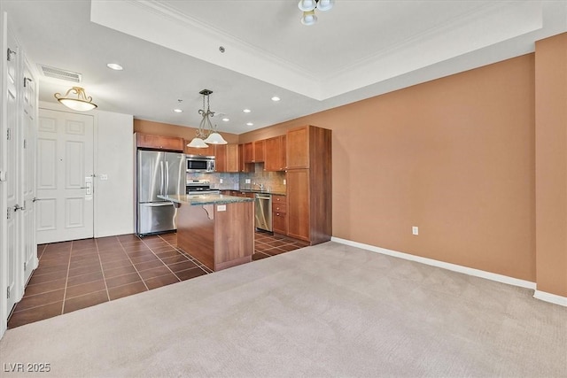 2455 W Serene Ave Unit 851, Las Vegas, NV 89123 - kitchen with stainless steel appliances, brown cabinets, a center island, backsplash, and a kitchen bar