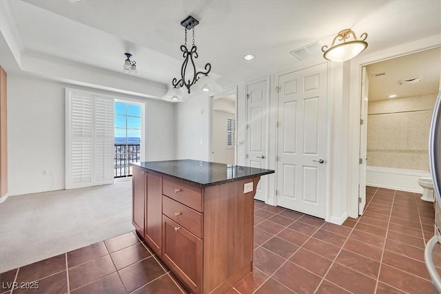 2455 W Serene Ave Unit 851, Las Vegas, NV 89123 - kitchen featuring dark tile patterned flooring, a center island, hanging light fixtures, recessed lighting, and dark colored carpet