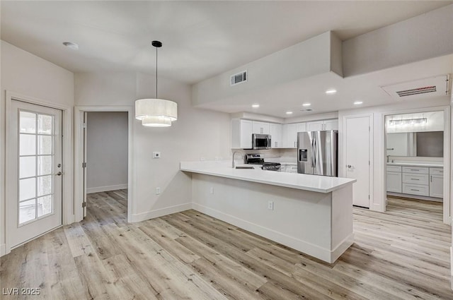 3400 Cabana Dr Unit 1048, Las Vegas, NV 89122 - kitchen featuring appliances with stainless steel finishes, a sink, light wood-style floors, light countertops, and recessed lighting