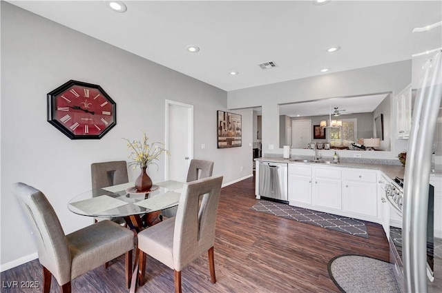 4020 Driscoll Mountain St, Las Vegas, NV 89129 - dining area with dark wood-style floors, a chandelier, baseboards, and recessed lighting