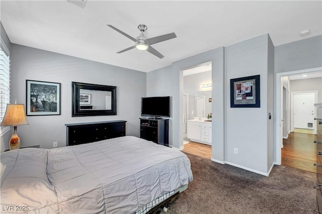 4020 Driscoll Mountain St, Las Vegas, NV 89129 - bedroom featuring dark colored carpet, baseboards, a ceiling fan, and ensuite bath