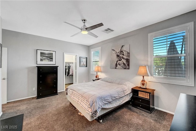 4020 Driscoll Mountain St, Las Vegas, NV 89129 - carpeted bedroom featuring a spacious closet, baseboards, a closet, and a ceiling fan