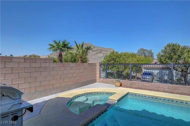 4020 Driscoll Mountain St, Las Vegas, NV 89129 - view of swimming pool with a pool with connected hot tub, a grill, and a mountain view