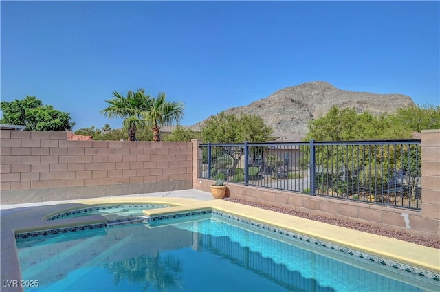 4020 Driscoll Mountain St, Las Vegas, NV 89129 - view of pool with an in-ground hot tub and a mountain view