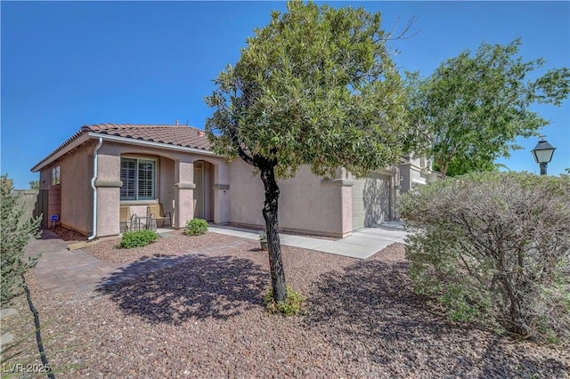 4020 Driscoll Mountain St, Las Vegas, NV 89129 - view of front of home featuring a tile roof and stucco siding