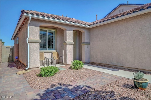 4020 Driscoll Mountain St, Las Vegas, NV 89129 - property entrance with stucco siding and a tiled roof