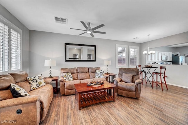 4020 Driscoll Mountain St, Las Vegas, NV 89129 - living area with ceiling fan, wood finished floors, and a chandelier