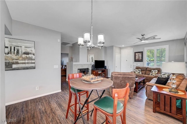 4020 Driscoll Mountain St, Las Vegas, NV 89129 - dining space featuring wood finished floors, ceiling fan, a chandelier, and baseboards